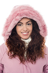 Image showing Permed hair woman wearing pink hood winter jacket