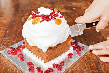 Image showing Cutting christmas cake