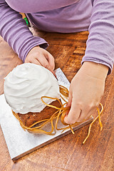 Image showing Woman decorating christmas cake