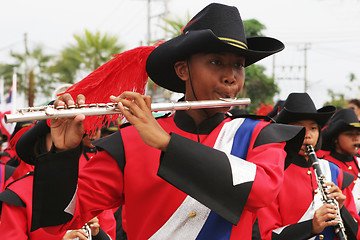 Image showing Thai student plays the flute during a parade in Phuket, Thailand