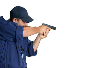 Image showing Officer on duty handling a weapon