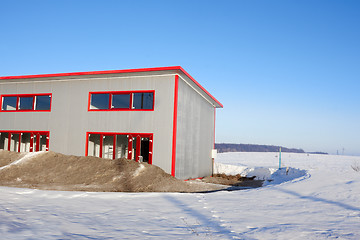 Image showing Frozen construction among winter field