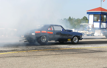 Image showing burning rubber