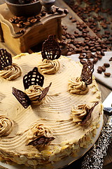 Image showing Cake and coffee grinder.