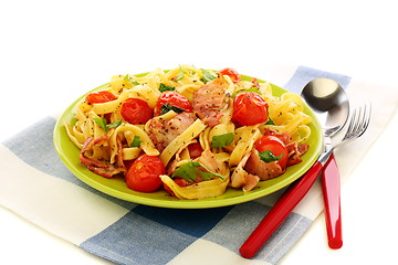 Image showing Pasta with bacon, tomatoes and basil.