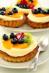 Image showing Baskets of pastry with custard.