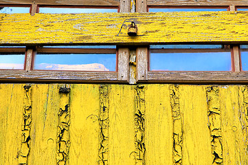 Image showing Old window yellow wall closed woody shutter