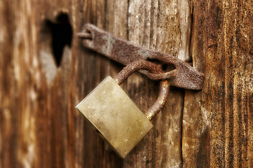 Image showing Old window with closed woody shutter