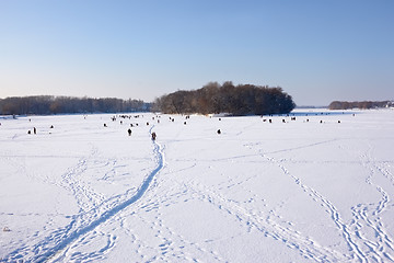 Image showing Winter fishing on frozen reservoir