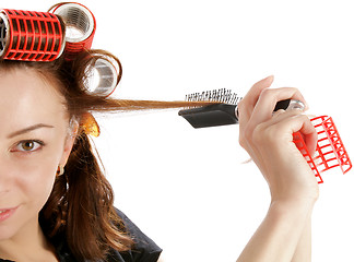 Image showing Young Woman in Curlers