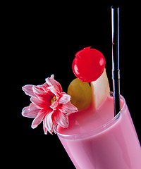 Image showing Alcohol  pink drink,  cocktail with flower, straw, isolated black