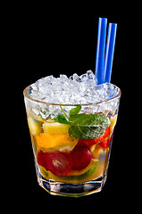 Image showing Alcohol drink, cocktail with fruits, ice, isolated black