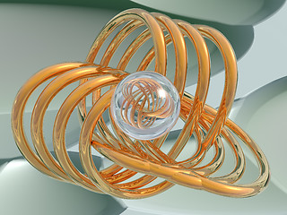Image showing Gold spirals and a glass sphere