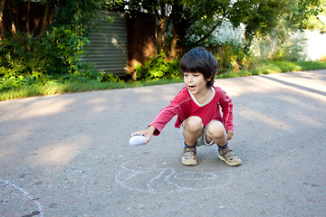 Image showing boy drawing on asphalt