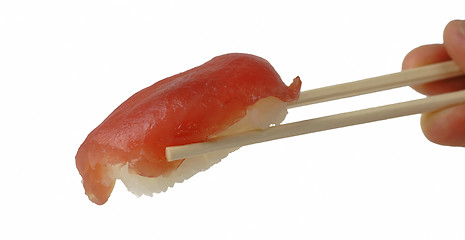 Image showing Tuna sushi in chopsticks