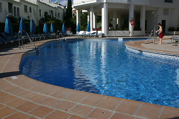 Image showing person showering before entering a swimming pool