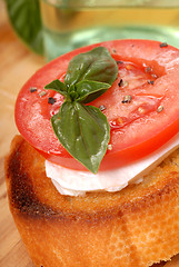 Image showing Bruschetta with tomato, mozzarella and basil