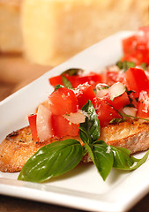 Image showing Bruschetta with tomato, mozzarella and basil