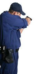 Image showing Security Officer aiming a gun