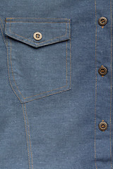 Image showing Denim blue jeans shirt with buttons detail texture