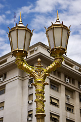 Image showing  gold street lamp and a  palace 