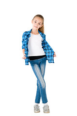 Image showing The girl in jeans and a checkered shirt