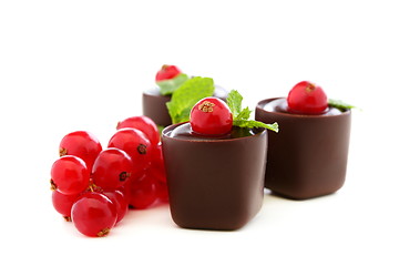 Image showing Handmade chocolates stuffed with jam and chocolate.