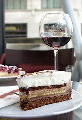 Image showing Red wine and tiramisu in Parisian cafe 