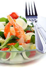 Image showing  Seafood salad with green leaf,cherry tomato and cheese closeup.