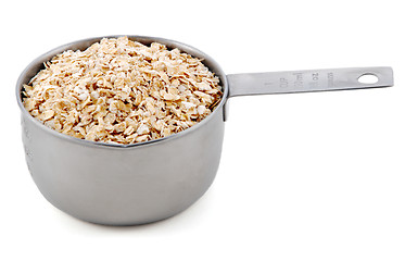 Image showing Porridge oats presented in an American metal cup measure