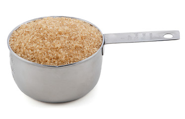 Image showing Demerera sugar presented in an American metal cup measure