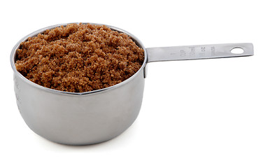 Image showing Dark brown soft / muscovado sugar presented in a cup measure