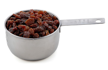 Image showing Raisins presented in an American metal cup measure