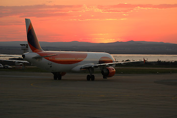 Image showing Plane and sunset