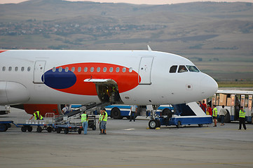 Image showing Workers and plane