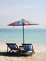 Image showing Deck chairs on a white sandy beach