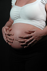Image showing Pregnant woman and hands