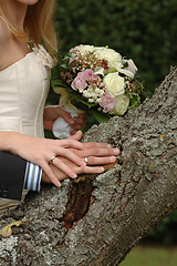 Image showing Hands, rings and bouquet