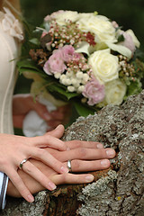 Image showing Hands, rings and bouquet