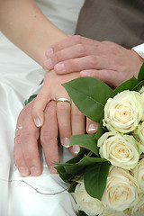 Image showing Hands, rings and bouquet