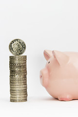 Image showing Piggy bank and stack of coins