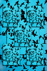 Image showing Set of silhouettes of birds on a blue background