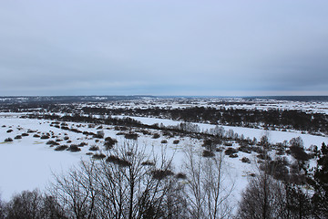 Image showing Winter landscape with frozen river and snow