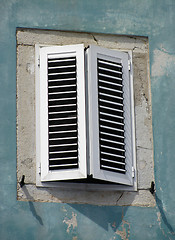 Image showing Old window on green wall