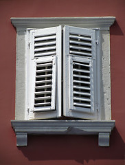 Image showing Old window on red wall