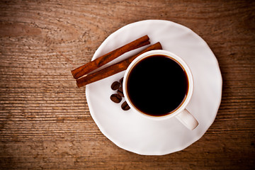 Image showing cup of coffee and cinnamon