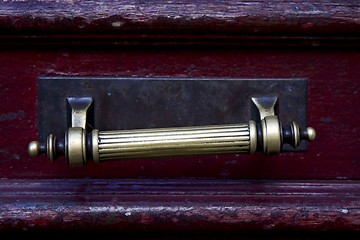 Image showing  knocker in a red closed  door