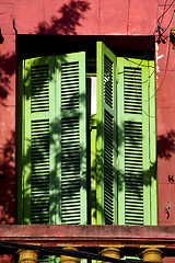 Image showing old  yellow little terrace green venetian blind 