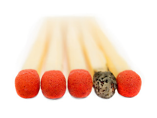 Image showing One used match