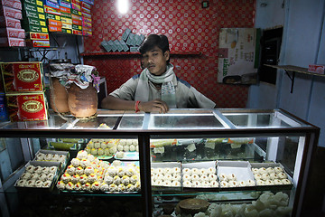 Image showing Portrait of the traders in the shop in Baruipur, West Bengal, India